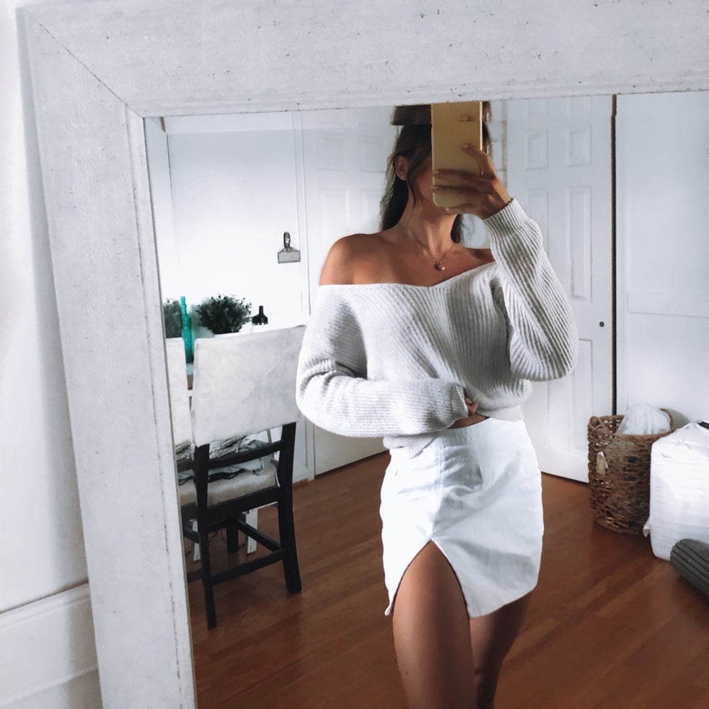 Off the shoulder pale blue sweater with cross back